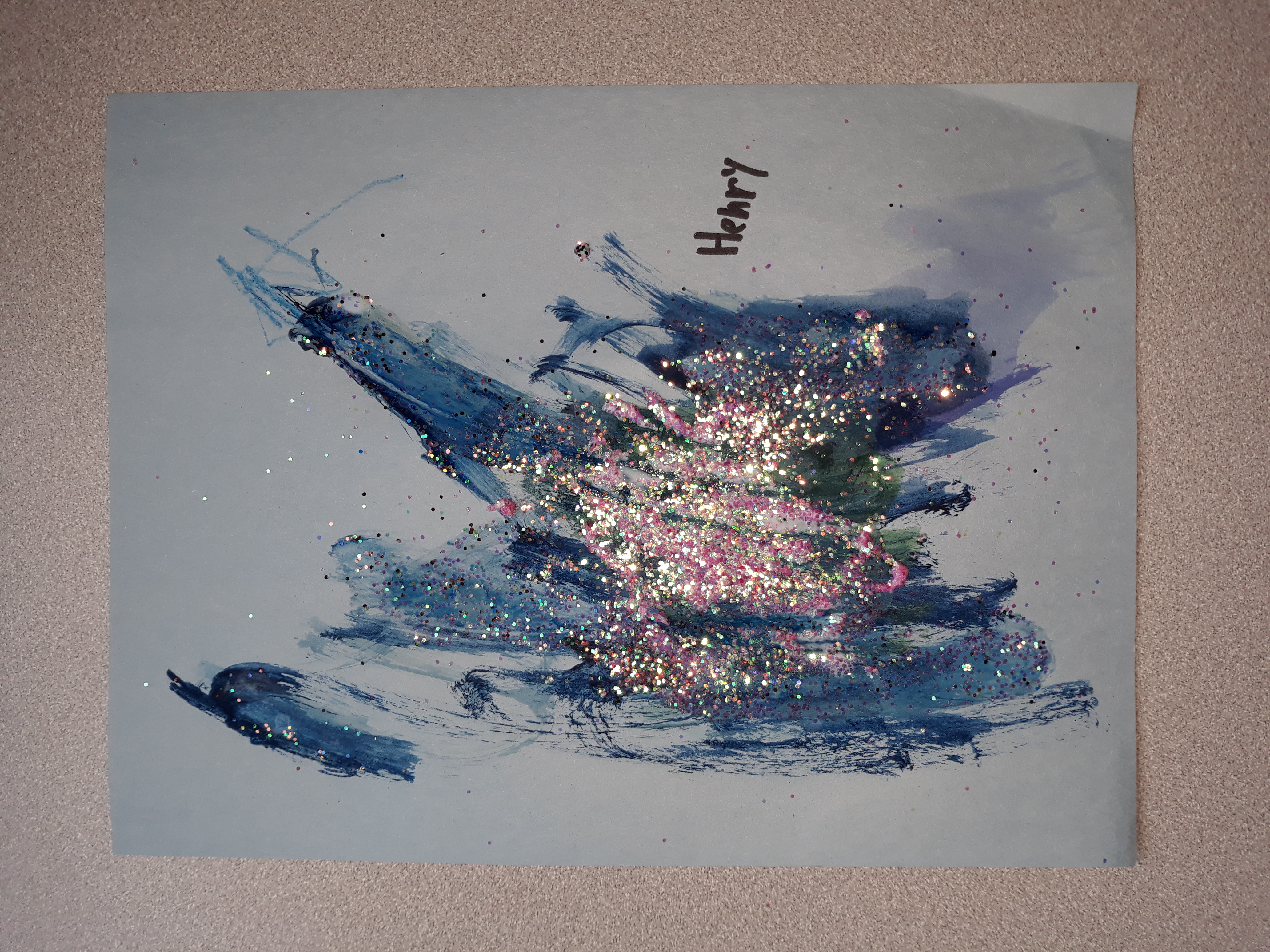 An explosion of blue and glitter fill the Space Collage of one workshop participant.